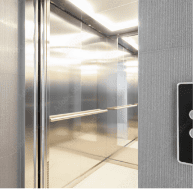 Silver elevator with door open. For over 30 years, John Evans’ Sons has been the leader in spring reel elevator door technology.